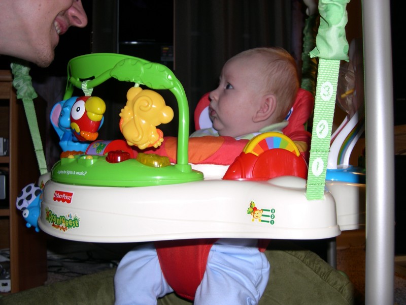 Nicky having fun with Daddy in the Jumperoo