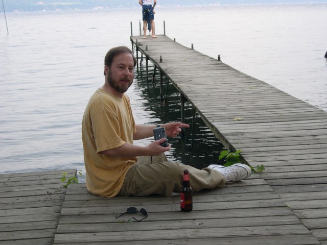 Don posing with Chuck and Jessica on the dock feeding the seagulls