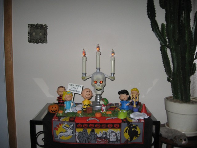 Peanuts toys with skull candelabra