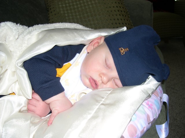 He's not a fan of hats, but he doesn't seem to mind this one from Aunt Marcie, Uncle Todd and Abbie