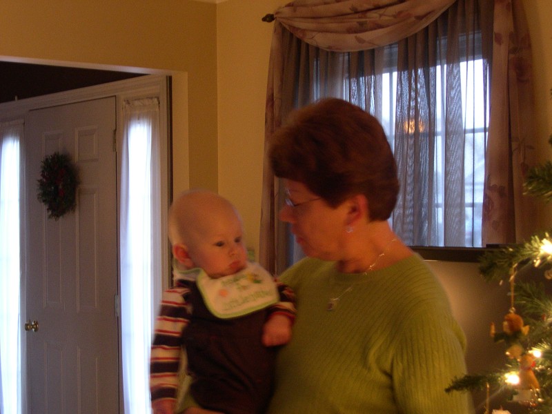 Aunt Carolyn and Nicky by the Christmas tree