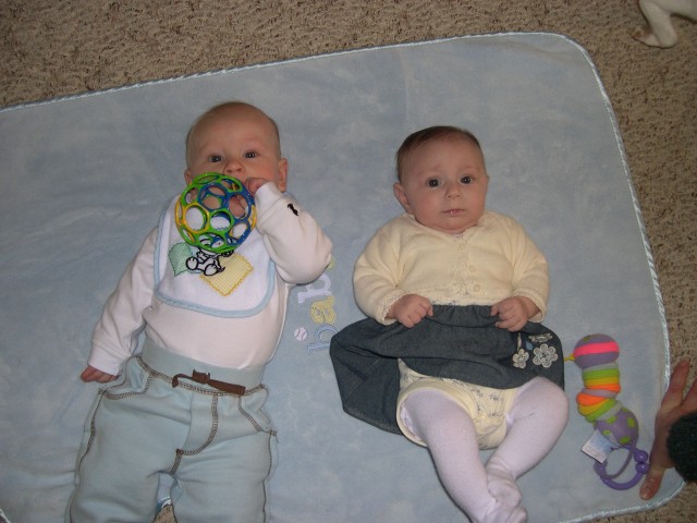 Nicky and Riley playing on the blanket