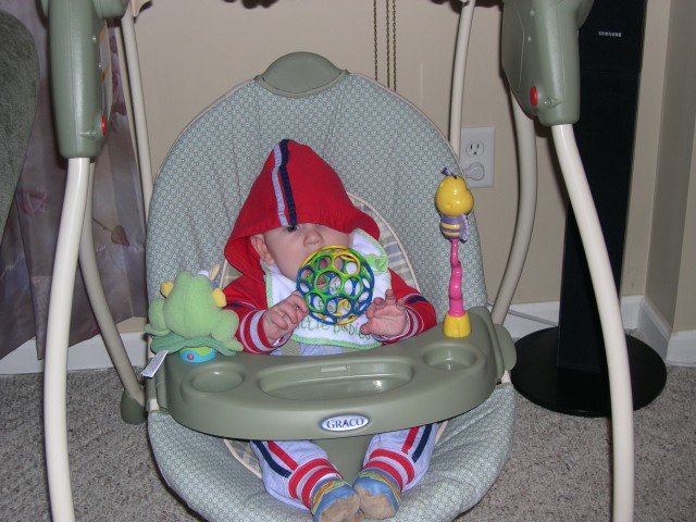 Nicky swinging and playing catch with Daddy