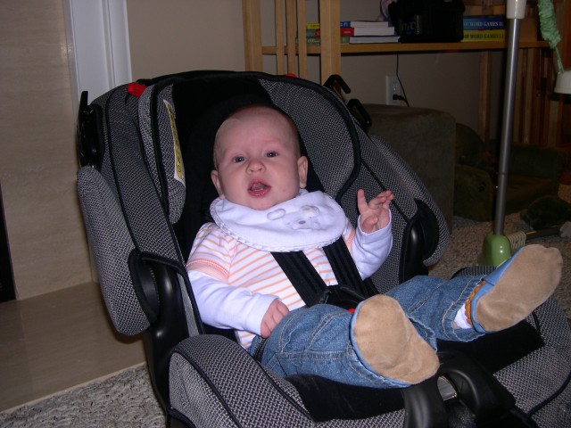 Nicky tries out his new car seat