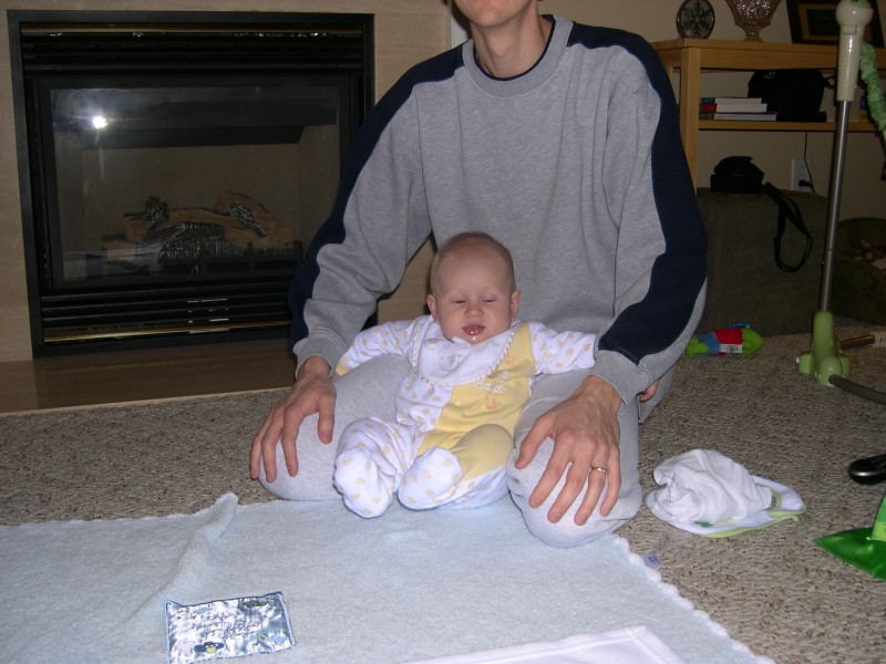 Nicky lounging on Daddy's lap