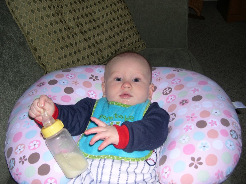 The first time Nicky ate cereal he didn't really want it, so Mommy put the rest in a bottle.