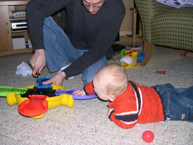 Nicky helping Daddy put together his new toy