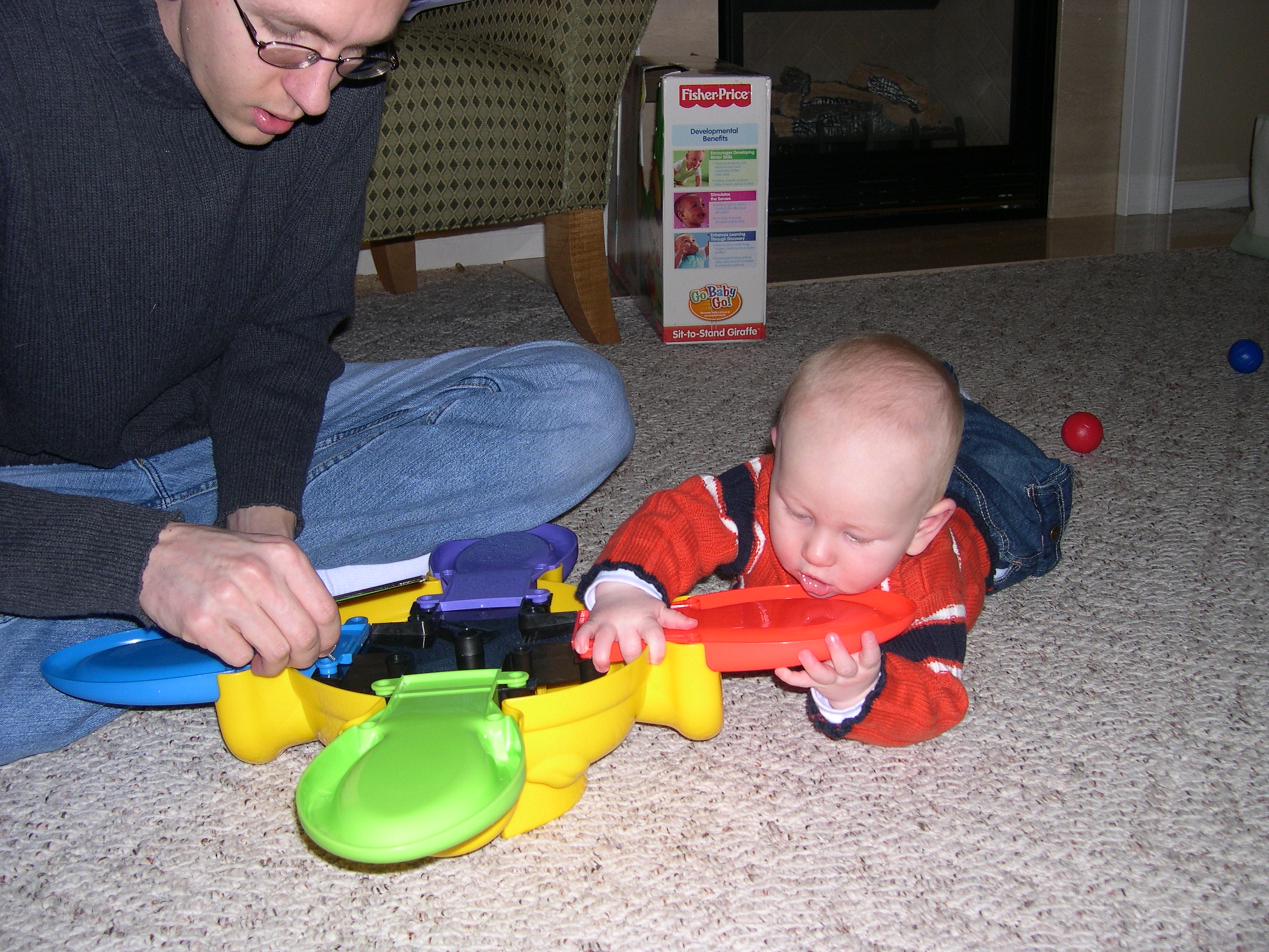 Nicky helping Daddy put together his new toy