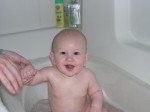 Holding Mommy's hand in the bath