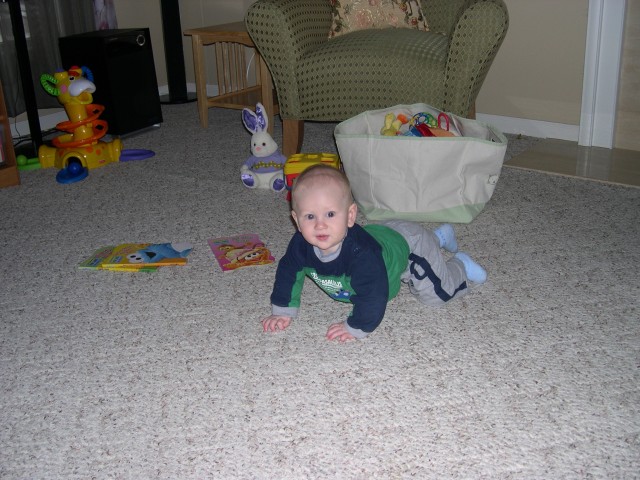 Nicky playing with his books from Aunt Carolyn