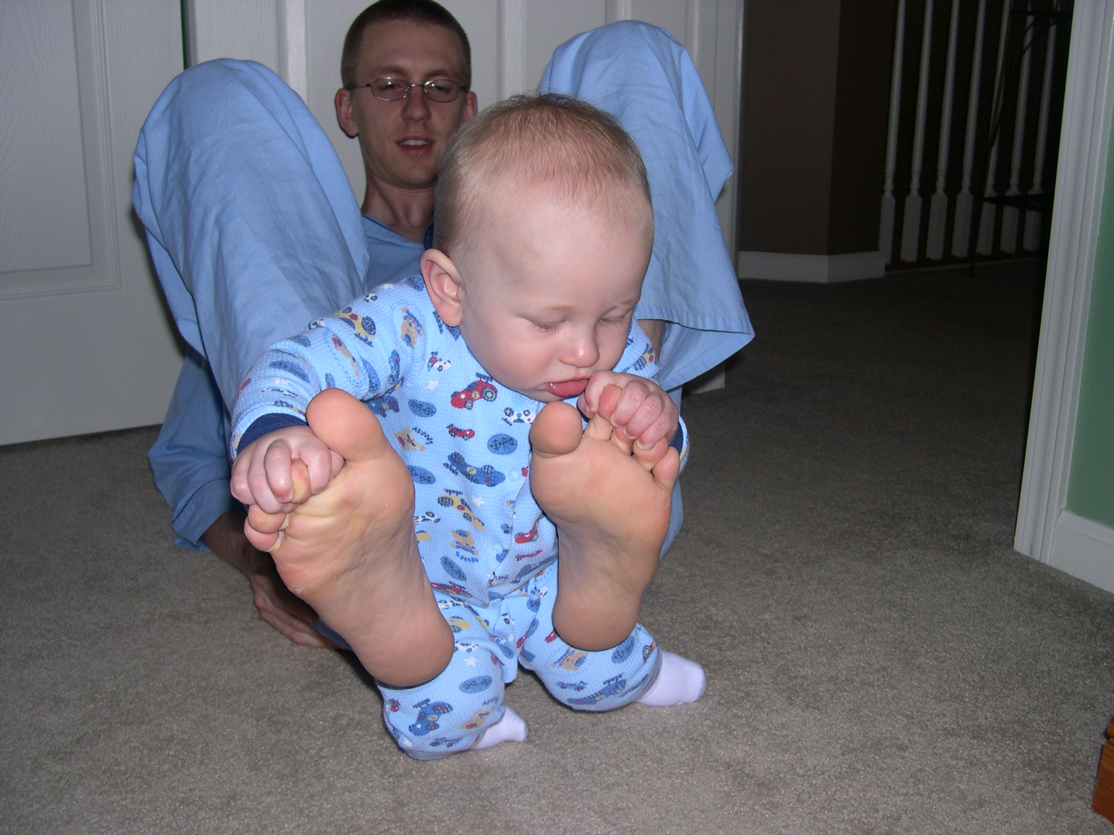 Nicky playing with Daddy's feet