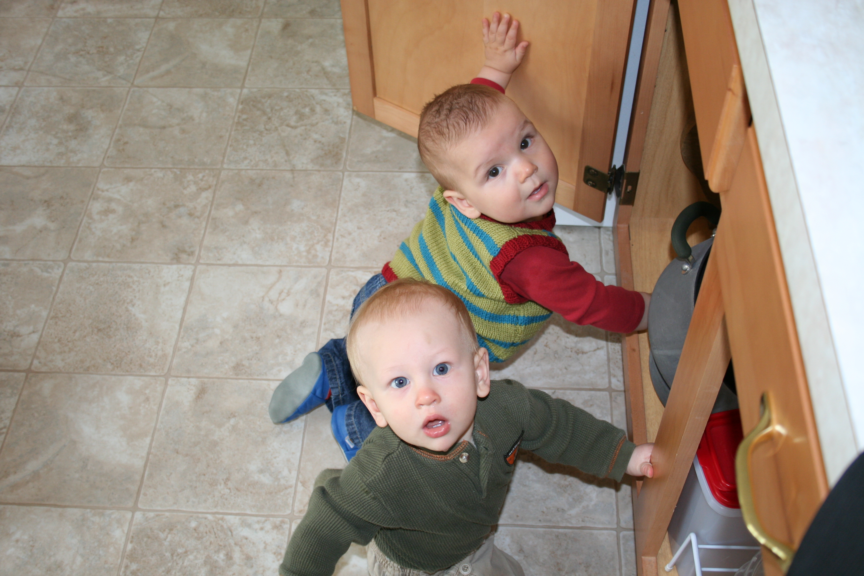 Nicky and Parker check out the pots and pans cupboard