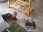 Nicky and Parker playing with cookware