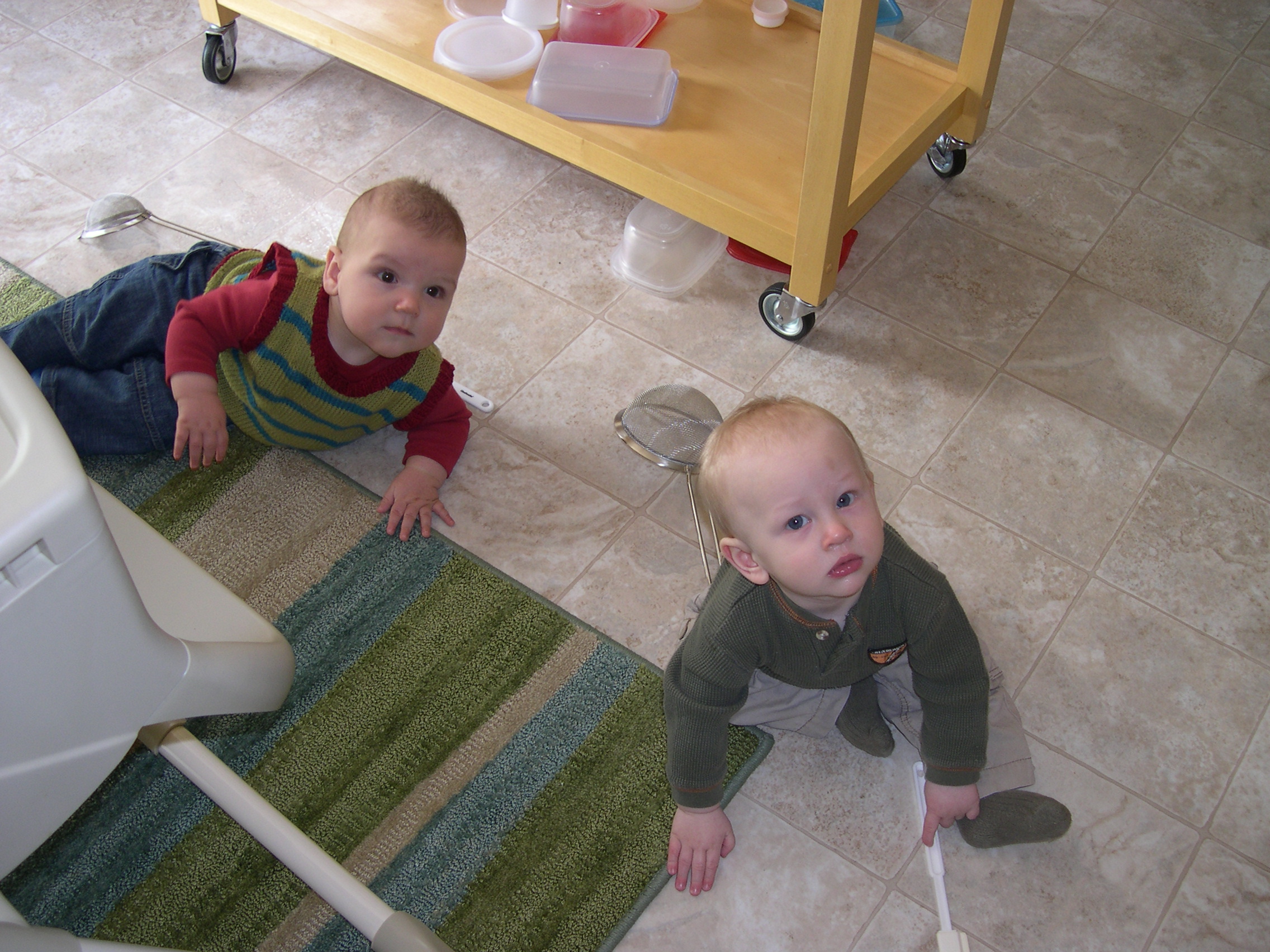 Nicky and Parker playing with cookware