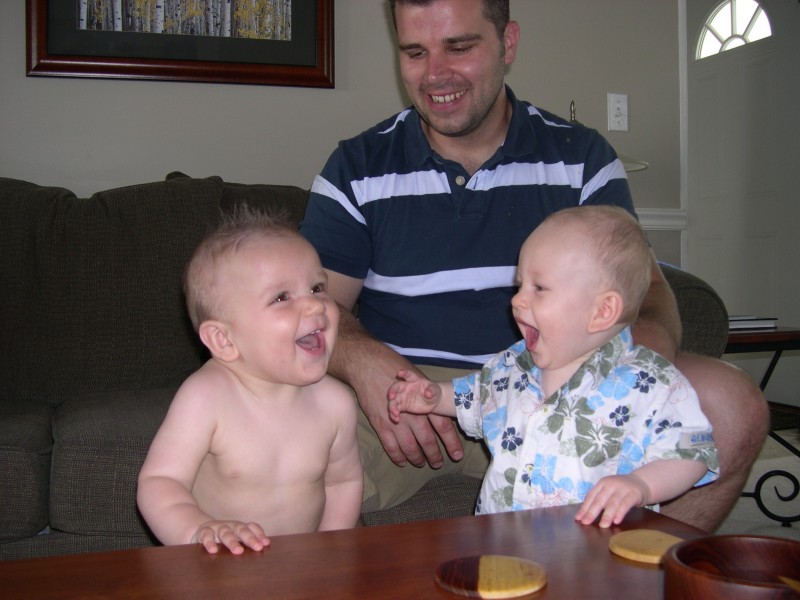 Nicky and Parker playing with the coasters while Darren watches