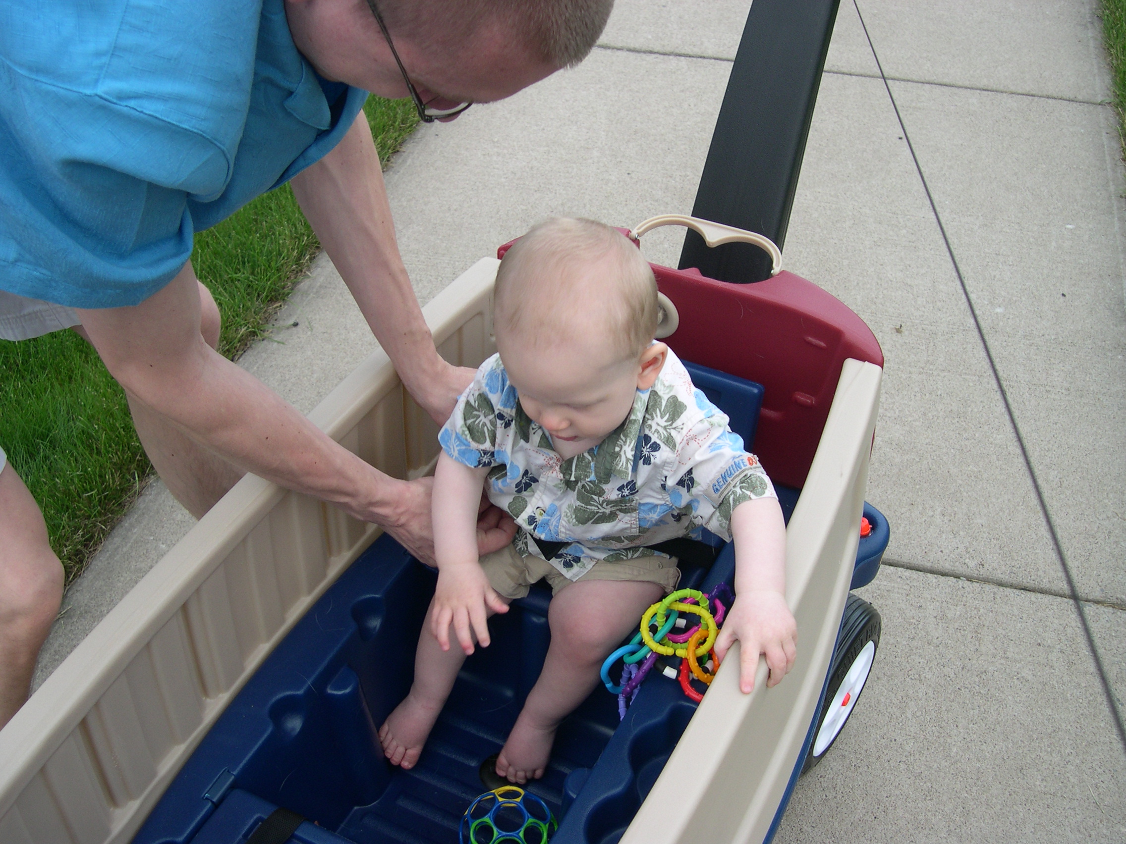 Daddy adjusting Nicky's seat belt