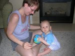 Nicky and Mommy playing with his ball