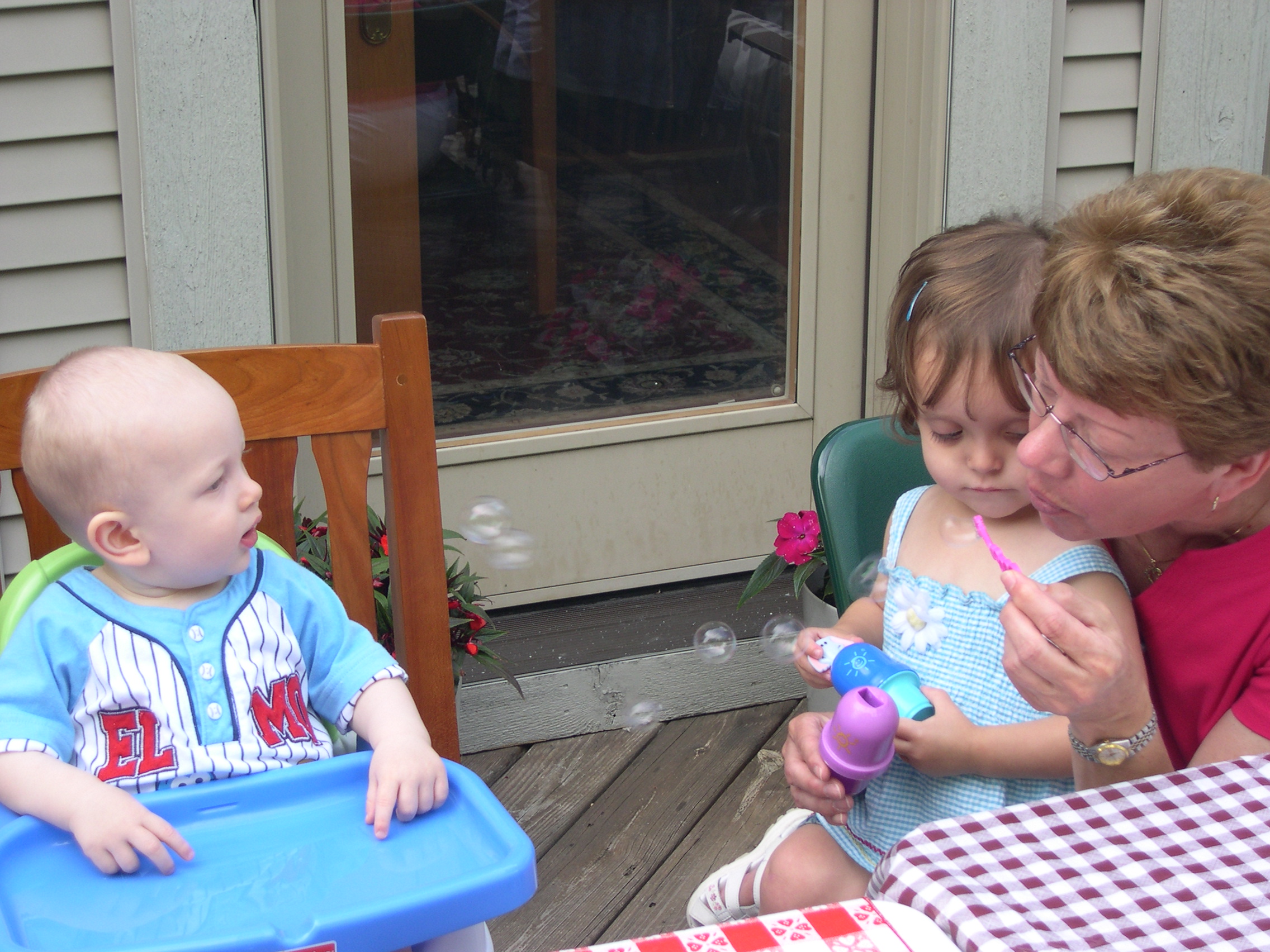 Blowing bubbles with Ella (Nicky's 3rd cousin) and Great-Aunt Carolyn