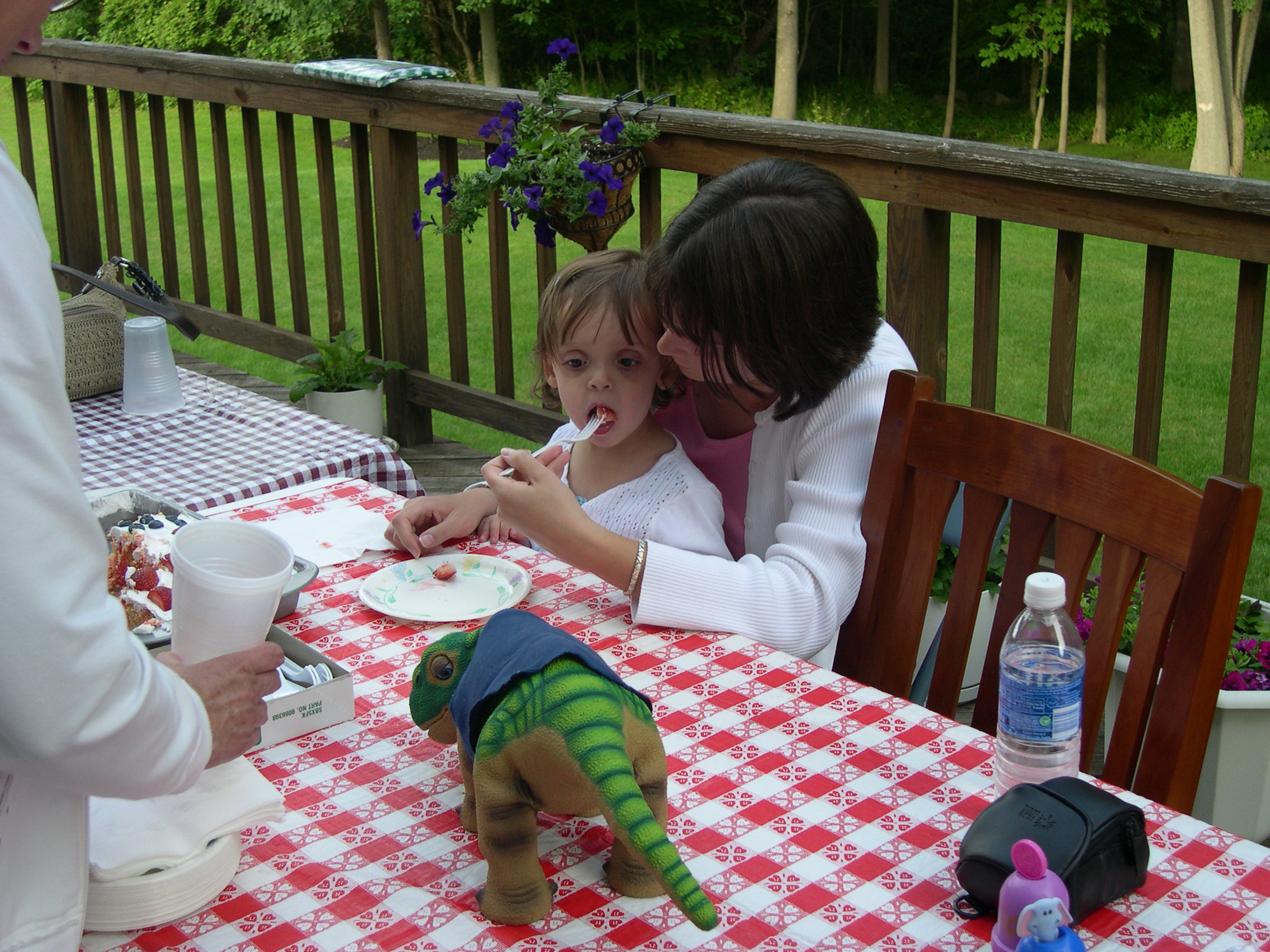 Diana (Ella's mommy) and Ella enjoying cake while Pleo watches