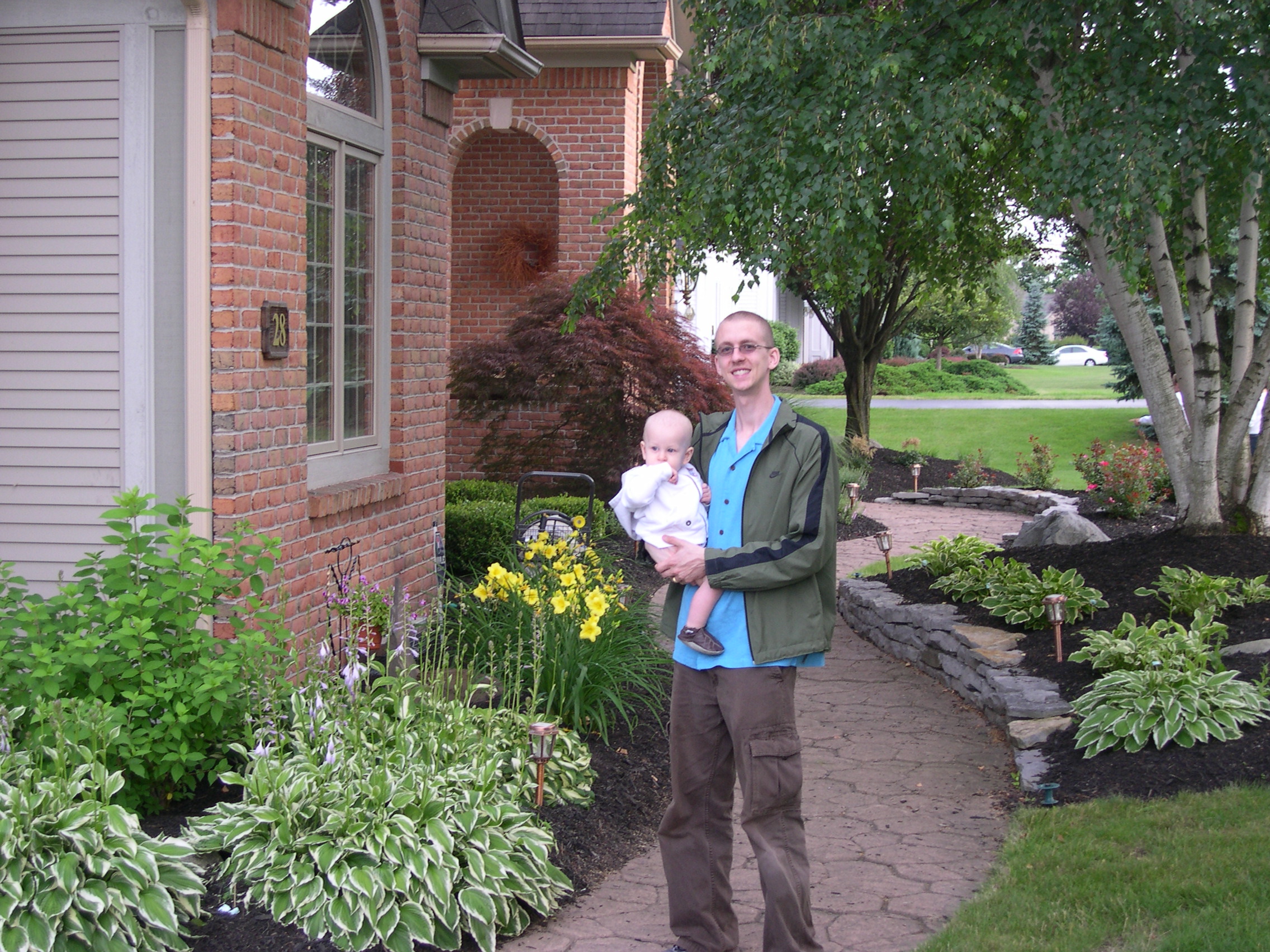 Daddy and Nicky walk around the garden