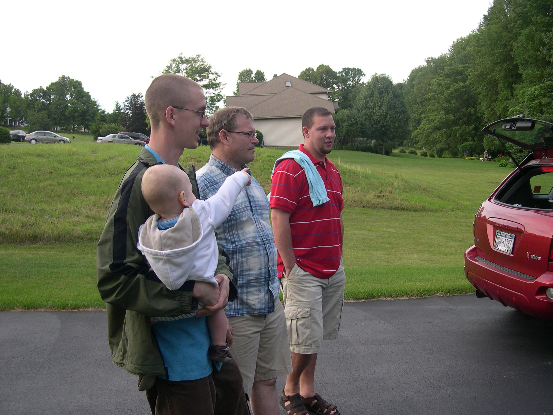 The boys look at the cars