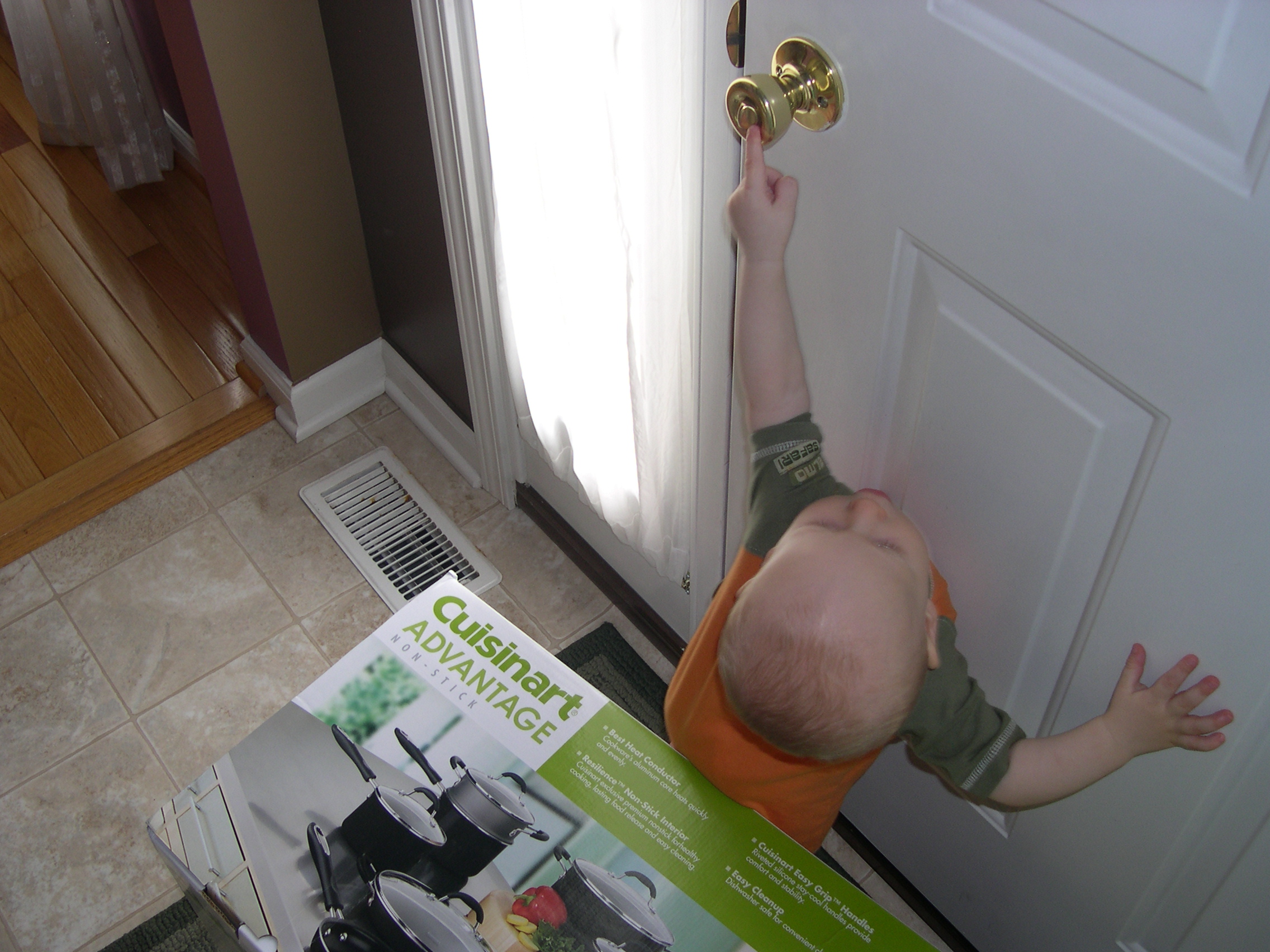 Ooh, he can reach the doorknob now!