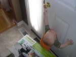 Ooh, he can reach the doorknob now!