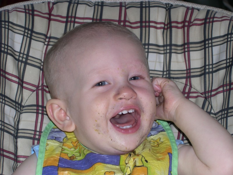 Blueberries all over his face!