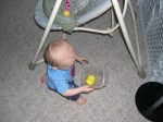 Nicky likes to carry things around with him; this is a bottle cover in a Gladware container.