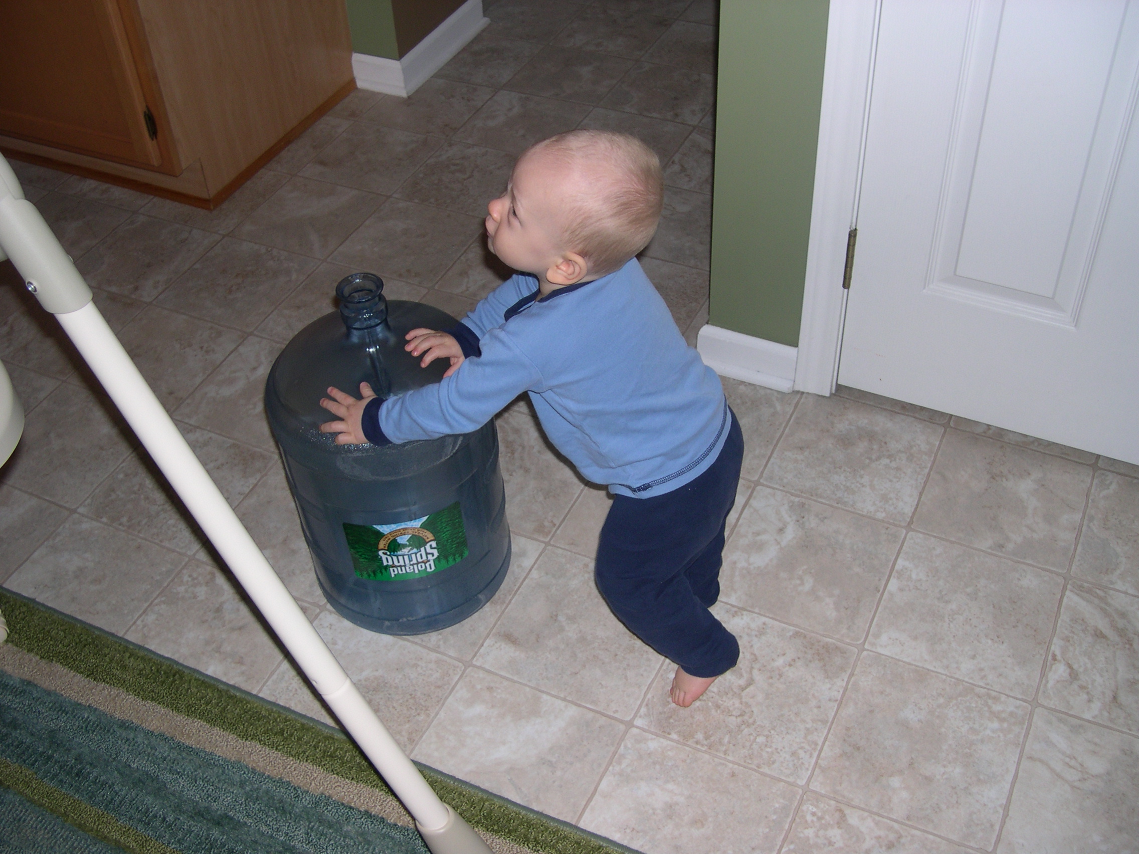 Pushing it along the kitchen floor