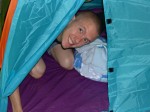 Daddy peeking out from the tent