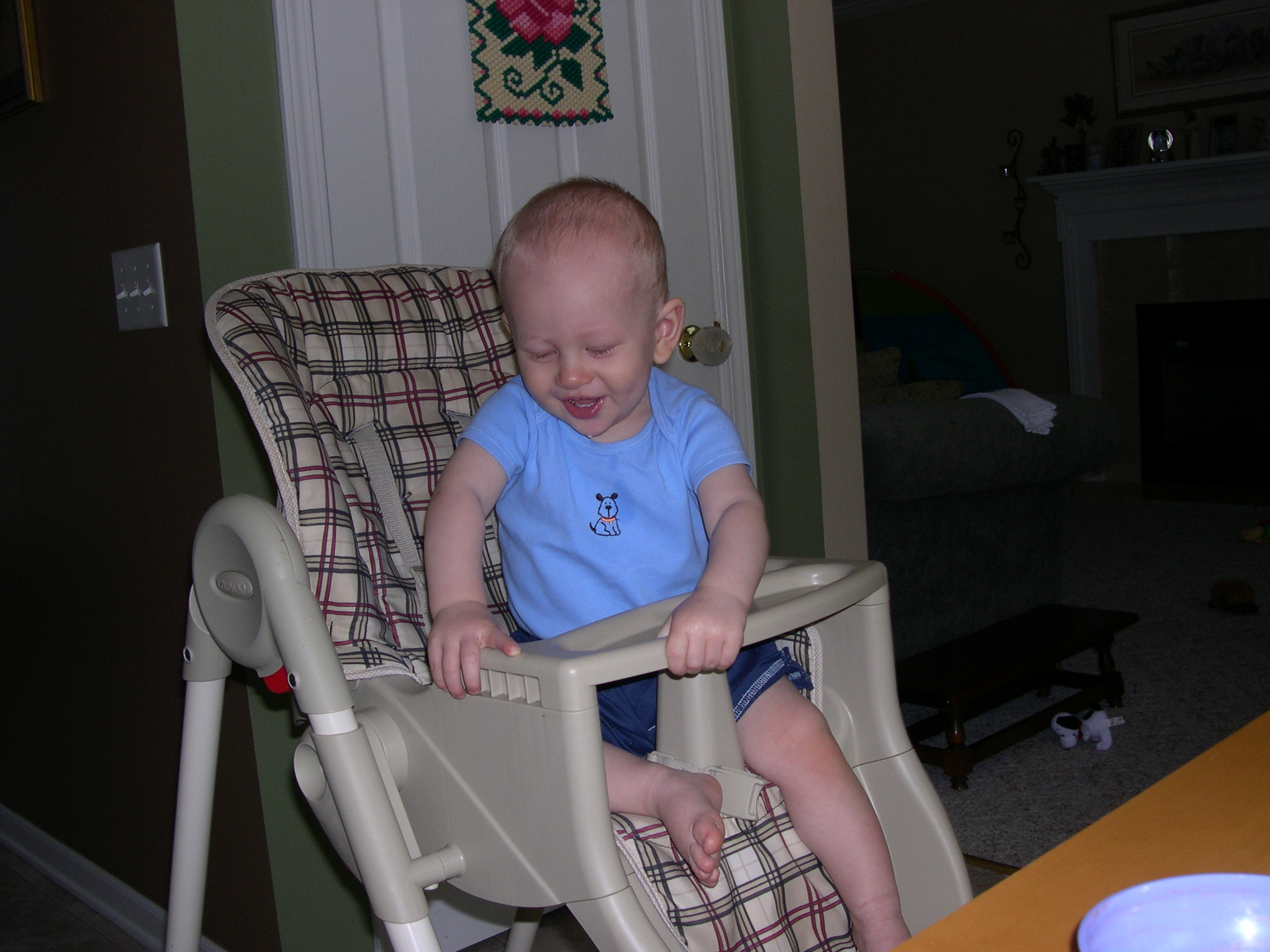 Nicky and Daddy playing in the high chair