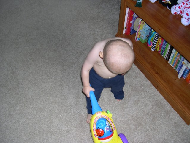 Vacuuming his room