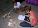 Mommy helping Nicky open his card from our neighbors