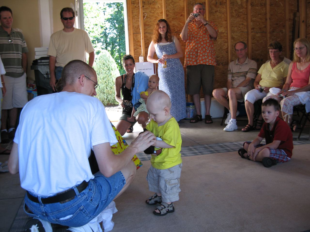 Daddy helping Nicky with his birthday presents