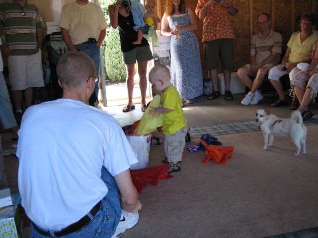 Nicky opening his birthday present from Parker