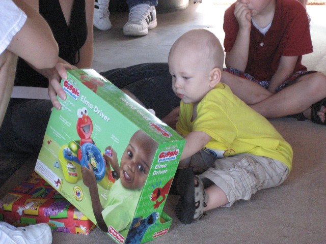 Nicky opening his birthday present from Great Aunt Carolyn