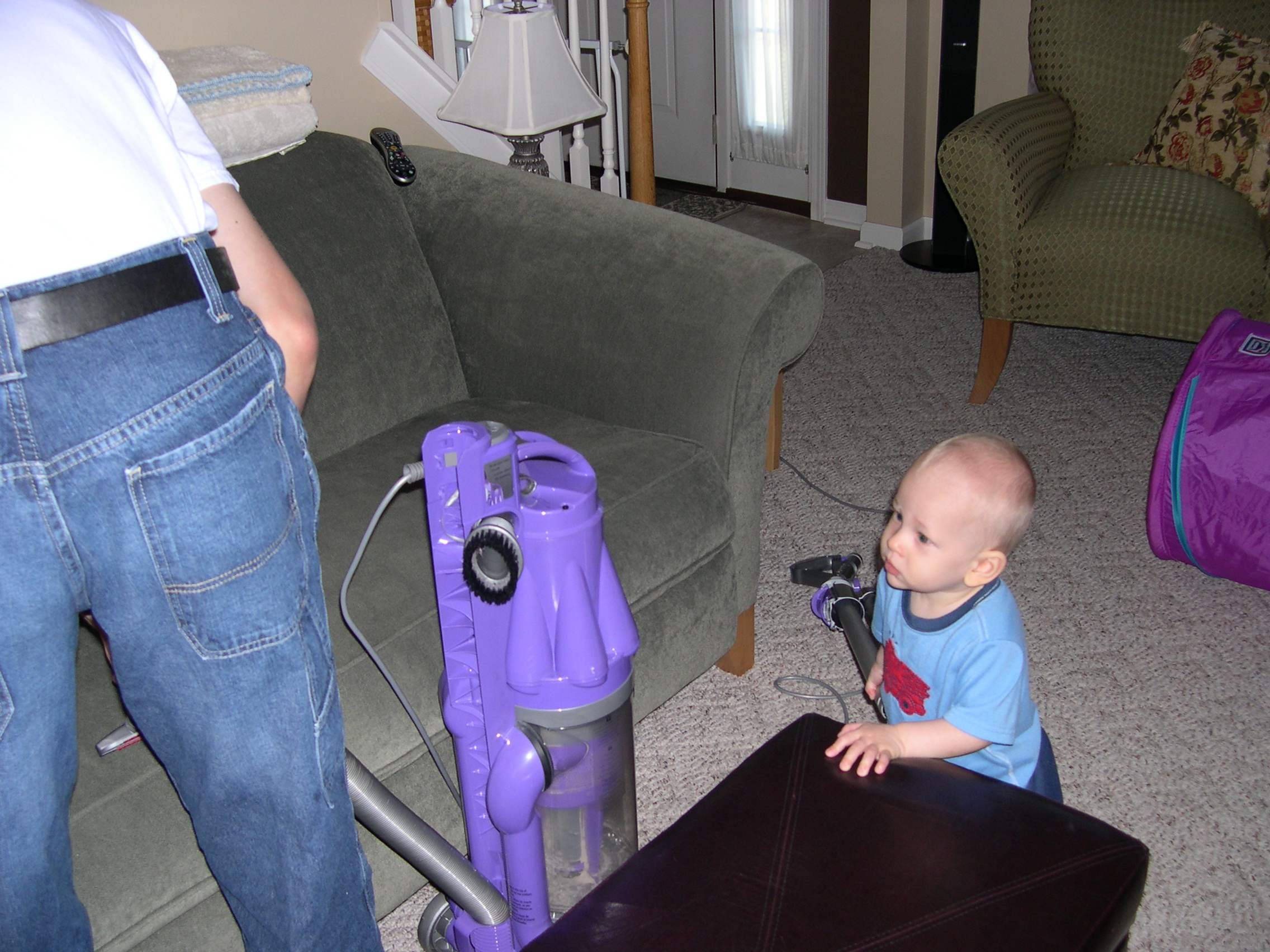 Nicky helping Daddy vacuum before the party