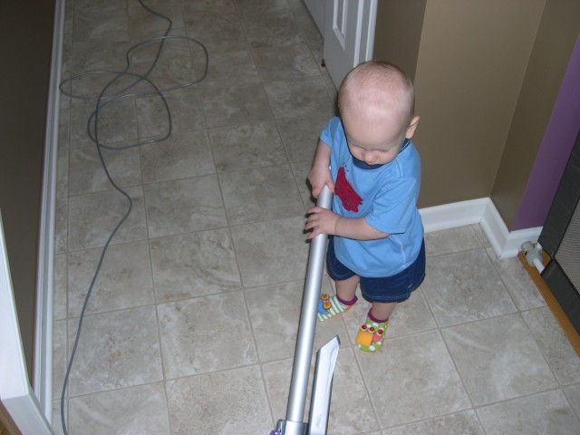 Nicky LOVES to vacuum!