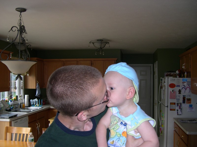 Daddy giving Nicky a kiss