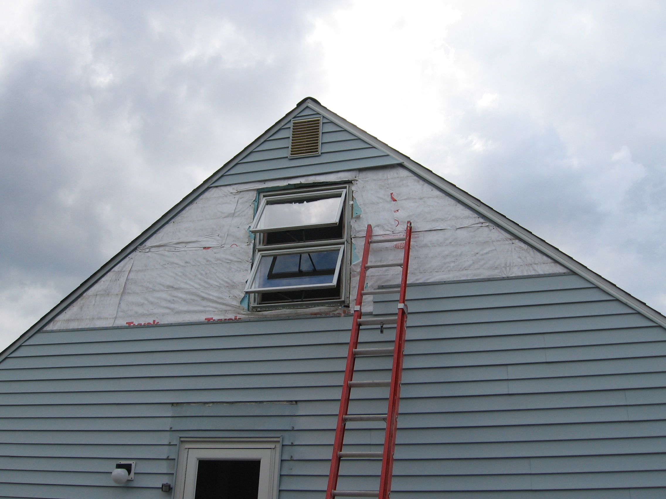 Driveway side of the house with the awning and siding removed