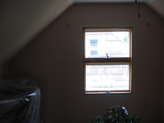 Upstairs hallway with the curtains down and trim removed