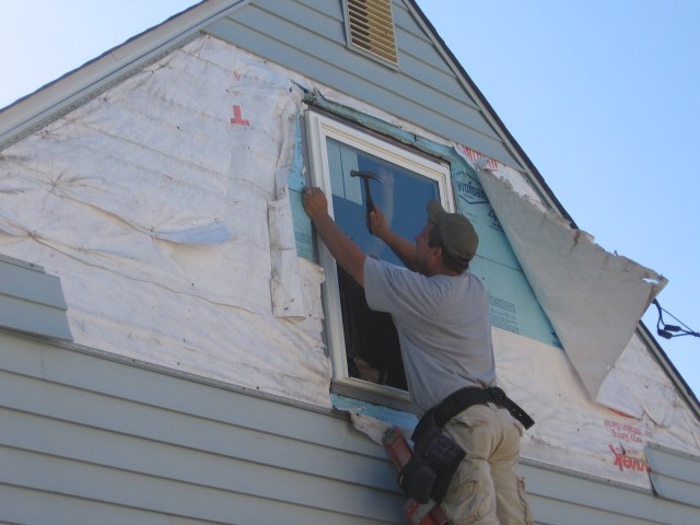 Upstairs hallway window being installed