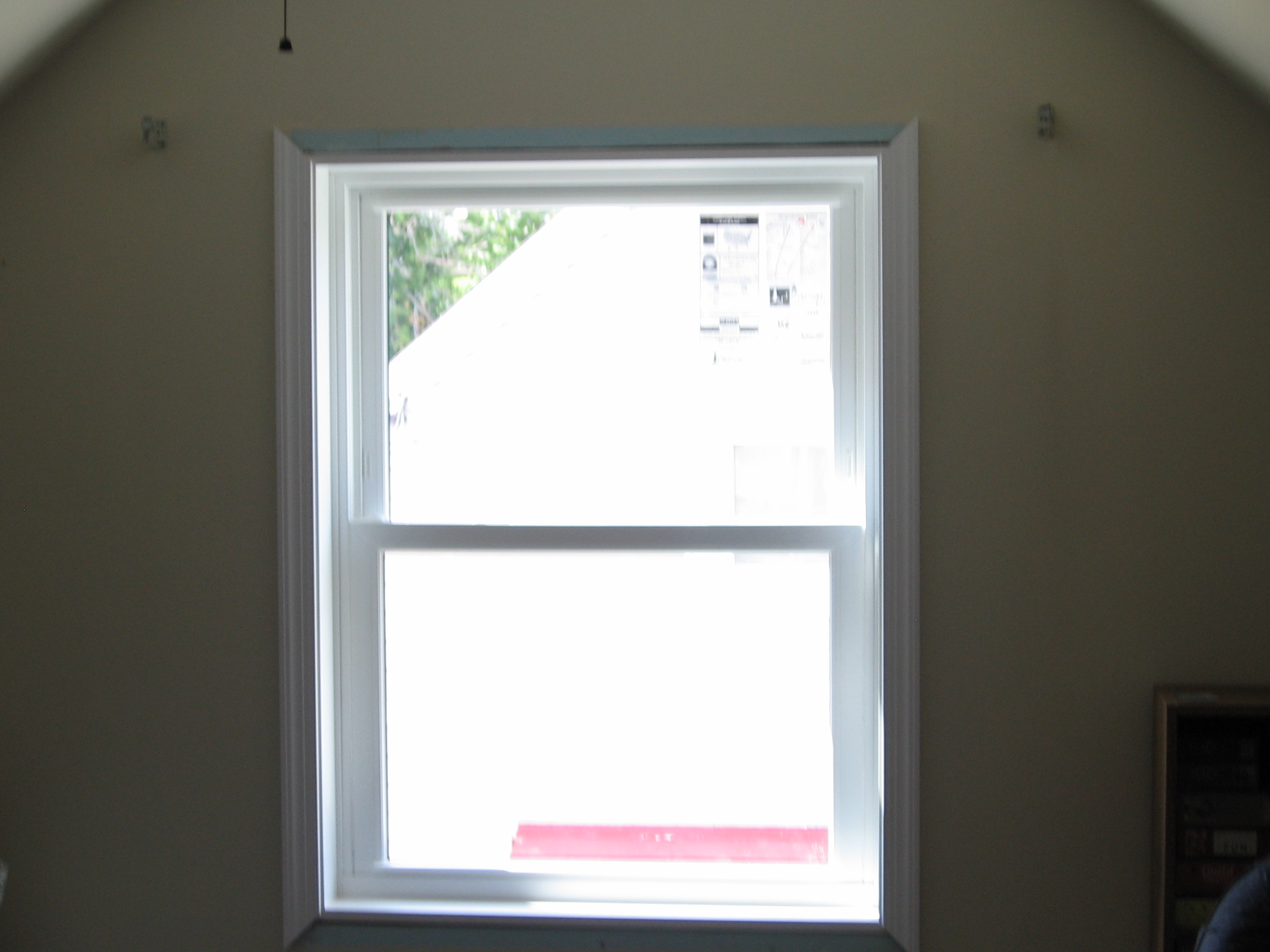 Upstairs bedroom with new trim going up