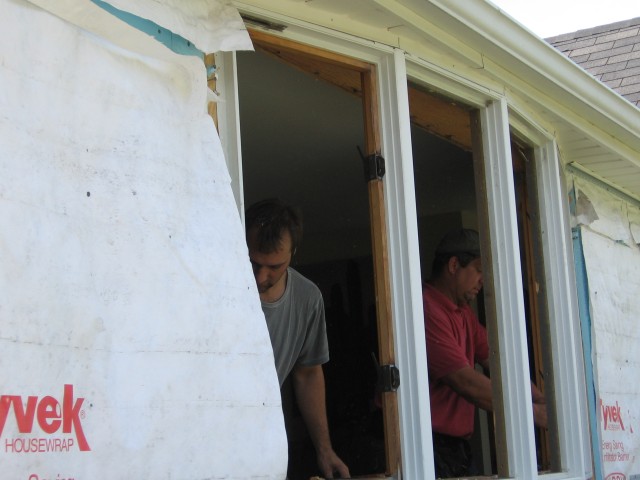 Dan and Ron removing old bow window