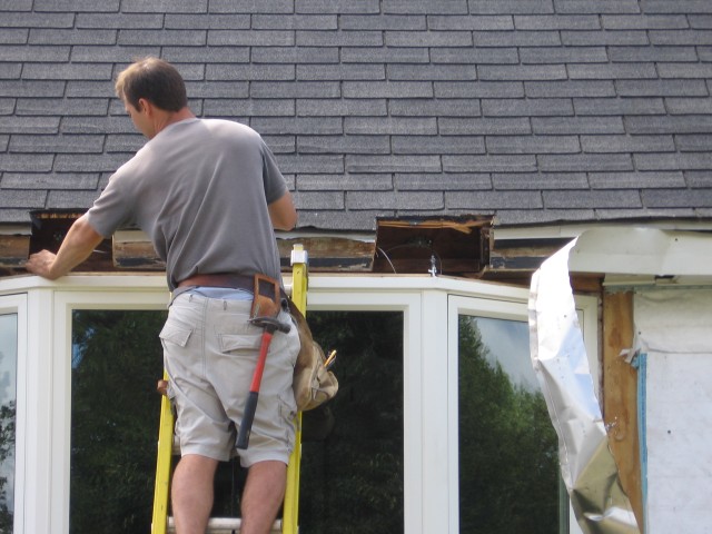 Dan attaching the cable to help hold the window up.