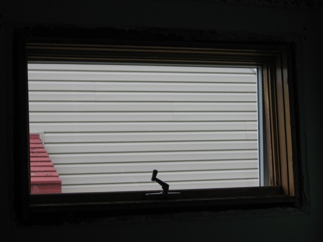 Old front bedroom side window with trim removed