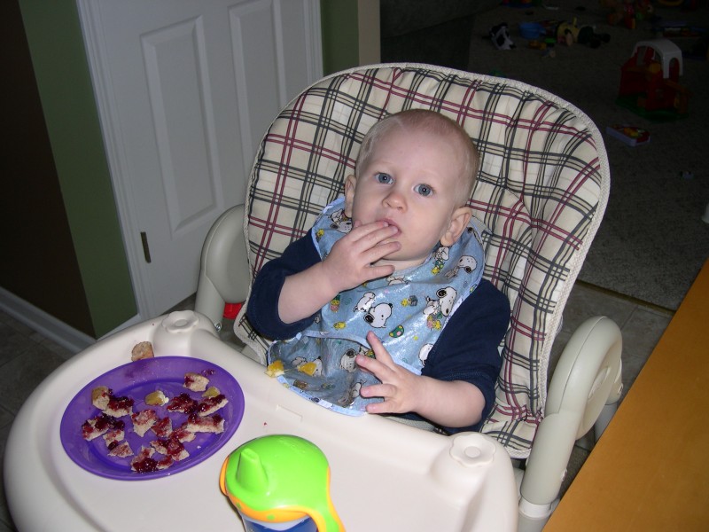 Nicky stuffing a jelly sandwich in his mouth