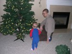 Nicky helping Daddy with the Christmas tree