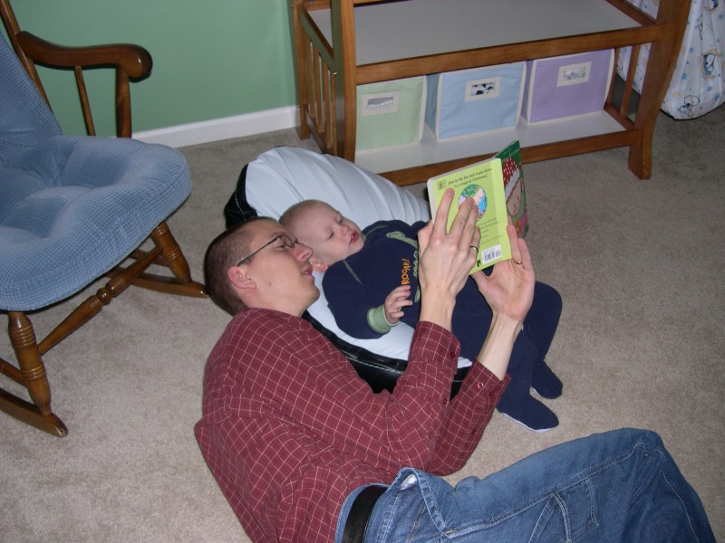 Nicky and Daddy reading together before bed